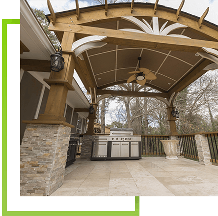 covered backyard patio with pergola, ceiling fan, and outdoor kitchen